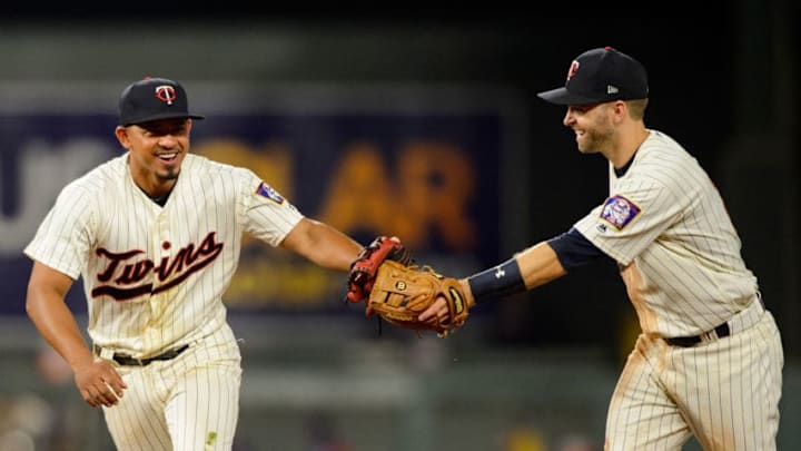 MINNEAPOLIS, MN - AUGUST 05: Eduardo Escobar #5 and Brian Dozier #2 of the Minnesota Twins celebrate a play against the Texas Rangers during the game on August 5, 2017 at Target Field in Minneapolis, Minnesota. The Rangers defeated the Twins 4-1. (Photo by Hannah Foslien/Getty Images)