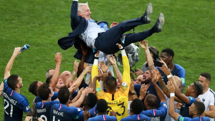 MOSCOW, RUSSIA - JULY 15, 2018: France's manager Didier Deschamps (top) and his players celebrate victory in the 2018 FIFA World Cup Final match between France and Croatia at Luzhniki Stadium. Stanislav Krasilnikov/TASS (Photo by Stanislav KrasilnikovTASS via Getty Images)