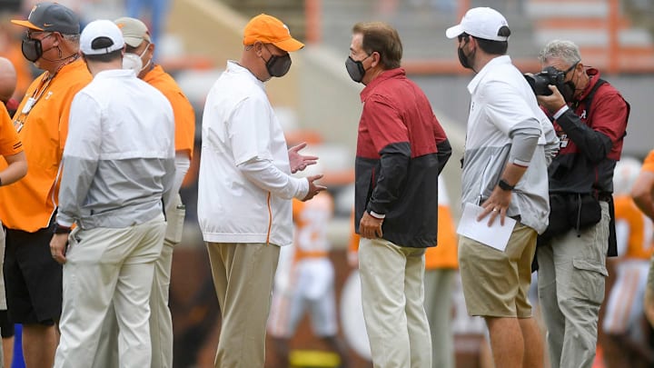 Oct 24, 2020; Knoxville, Tennessee, USA; Tennessee head coach Jeremy Pruitt and Alabama head coach Nick Saban speak before a game between Tennessee and Alabama at Neyland Stadium in Knoxville, Tenn. Mandatory Credit: Caitie McMekin-USA TODAY NETWORK