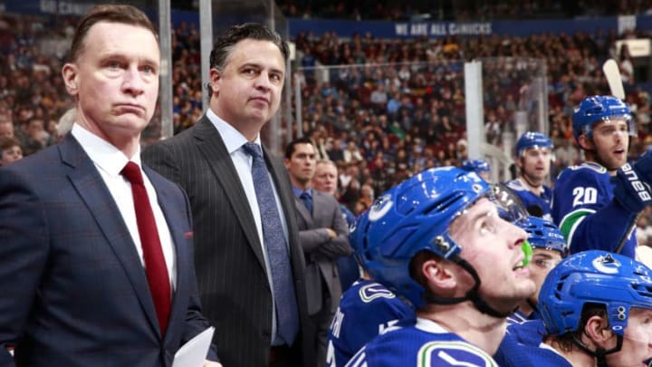 VANCOUVER, BC - OCTOBER 20: Head coach Travis Green of the Vancouver Canucks (2nd-left) looks on from the bench during their NHL game against the Boston Bruins at Rogers Arena October 20, 2018 in Vancouver, British Columbia, Canada. Vancouver won 2-1 in overtime. (Photo by Jeff Vinnick/NHLI via Getty Images)