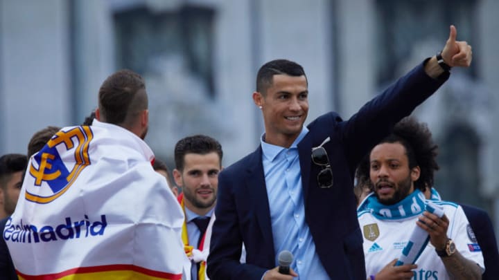 MADRID, SPAIN - MAY 27: Cristiano Ronaldo of Real Madrid CF celebrates their Champions League victory with teammates Sergio Ramos (L); Nacho Fernandez (2ndL) and Marcelo (R) at Cibeles Square a day after winning their 13th European Cup and UEFA Champions League Final on May 27, 2018 in Madrid, Spain. (Photo by Gonzalo Arroyo Moreno/Getty Images)