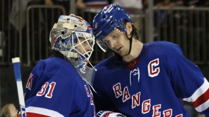 NEW YORK, NEW YORK - DECEMBER 22: Igor Shesterkin #31 and Jacob Trouba #8 of the New York Rangers celebrate their 5-3 victory over the New York Islanders at Madison Square Garden on December 22, 2022 in New York City. (Photo by Bruce Bennett/Getty Images)