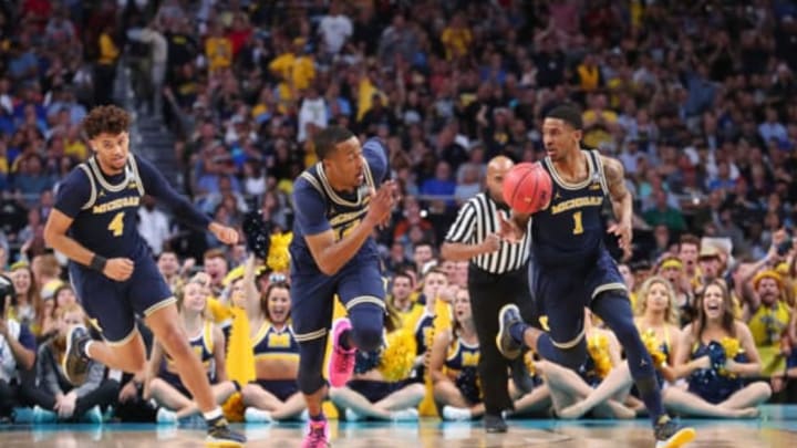 SAN ANTONIO, TX – APRIL 02: Charles Matthews #1 of the Michigan Wolverines brings the ball up the court with teammates Isaiah Livers #4 and Muhammad-Ali Abdur-Rahkman #12 against the Villanova Wildcats in the first half during the 2018 NCAA Men’s Final Four National Championship game at the Alamodome on April 2, 2018 in San Antonio, Texas. (Photo by Tom Pennington/Getty Images)