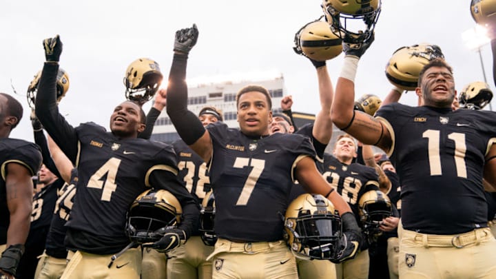 WEST POINT, NY - NOVEMBER 17: Cam Thomas #4, Jaylon McClinton #7, and Donavan Lynch #11 of the Army Black Knights sing the alma mater after winning a game against the Colgate Raiders at Michie Stadium on November 17, 2018 in West Point, New York. (Photo by Dustin Satloff/Getty Images)