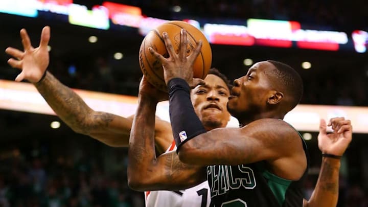 BOSTON, MA - MARCH 31: Terry Rozier #12 of the Boston Celtics is fouled by DeMar DeRozan #10 of the Toronto Raptors during a game at TD Garden on March 31, 2018 in Boston, Massachusetts. NOTE TO USER: User expressly acknowledges and agrees that, by downloading and or using this photograph, User is consenting to the terms and conditions of the Getty Images License Agreement. (Photo by Adam Glanzman/Getty Images)