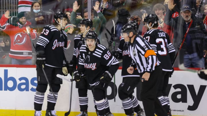 Feb 13, 2022; Newark, New Jersey, USA; The New Jersey Devils celebrate a goal by New Jersey Devils center Jack Hughes (86) against the Pittsburgh Penguins during the second period at Prudential Center. Mandatory Credit: Ed Mulholland-USA TODAY Sports