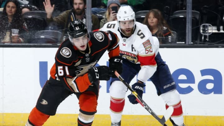 ANAHEIM, CA - MARCH 17: Troy Terry #61 of the Anaheim Ducks races for the puck against Aaron Ekblad #5 of the Florida Panthers during the game on March 17, 2019 at Honda Center in Anaheim, California. (Photo by Debora Robinson/NHLI via Getty Images)