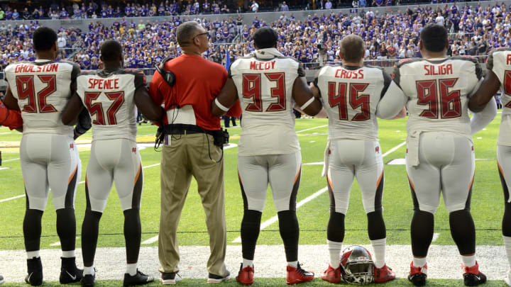 MINNEAPOLIS, MN – SEPTEMBER 24: Tampa Bay Buccaneers players link arms on the sidelines during the national anthem before the game against the Minnesota Vikings on September 24, 2017 at U.S. Bank Stadium in Minneapolis, Minnesota. (Photo by Hannah Foslien/Getty Images)
