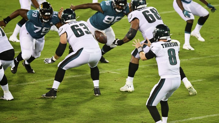 JACKSONVILLE, FLORIDA – AUGUST 15: Clayton Thorson #8 of the Philadelphia Eagles looks to catch the snap from Nate Herbig #67 during the second half of a preseason football game against the Jacksonville Jaguars at TIAA Bank Field on August 15, 2019 in Jacksonville, Florida. (Photo by Julio Aguilar/Getty Images)
