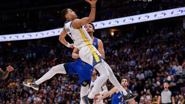 Apr 21, 2022; Denver, Colorado, USA; Golden State Warriors guard Jordan Poole (3) drives to the net against Denver Nuggets guard Bryn Forbes (6) in the third quarter during game three of the first round of the 2022 NBA playoffs at Ball Arena. Mandatory Credit: Isaiah J. Downing-USA TODAY Sports