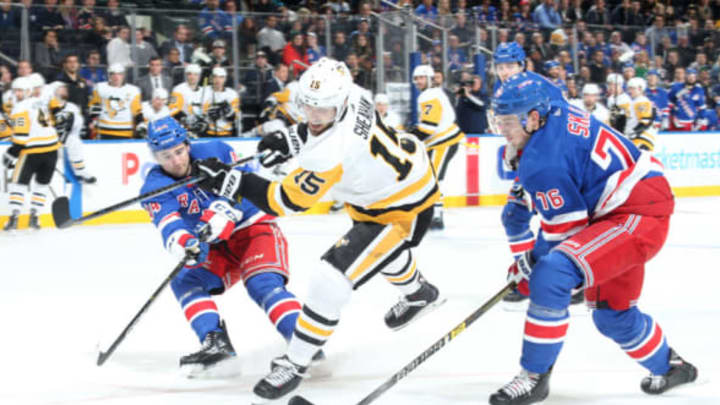 NEW YORK, NY – JANUARY 02: Riley Sheahan #15 of the Pittsburgh Penguins skates with the puck against Brady Skjei #76 and Neal Pionk #44 of the New York Rangers at Madison Square Garden on January 2, 2019 in New York City. The Pittsburgh Penguins won 7-2. (Photo by Jared Silber/NHLI via Getty Images)