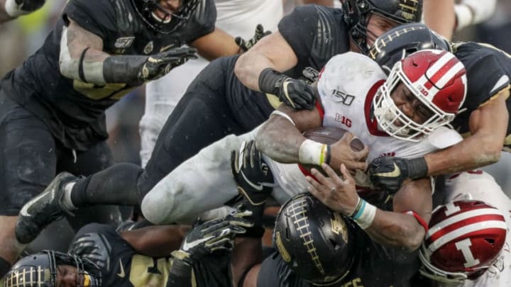 WEST LAFAYETTE, IN - NOVEMBER 30: Sampson James #24 of the Indiana Hoosiers is tackled by the Purdue Boilermakers in the first half at Ross-Ade Stadium on November 30, 2019 in West Lafayette, Indiana. (Photo by Michael Hickey/Getty Images)