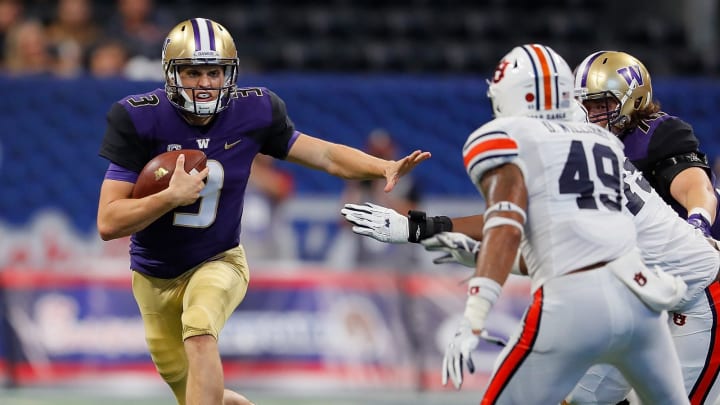 ATLANTA, GA – SEPTEMBER 01: Jake Browning #3 of the Washington Huskies rushes away from Darrell Williams #49 and Andrew Williams #79 of the Auburn Tigers at Mercedes-Benz Stadium on September 1, 2018 in Atlanta, Georgia. (Photo by Kevin C. Cox/Getty Images)