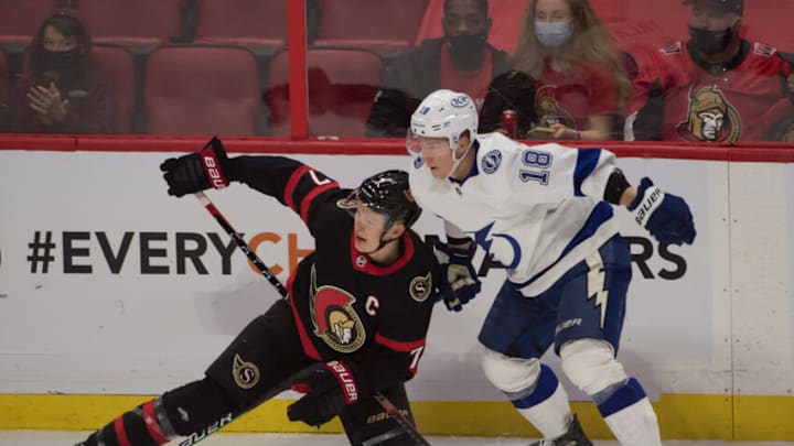 Nov 6, 2021; Ottawa, Ontario, CAN; Ottawa Senators left wing Brady Tkachuk (7) battles with Tampa Bay Lightning left wing Ondrej Palat (18) in the third period at the Canadian Tire Centre. Mandatory Credit: Marc DesRosiers-USA TODAY Sports