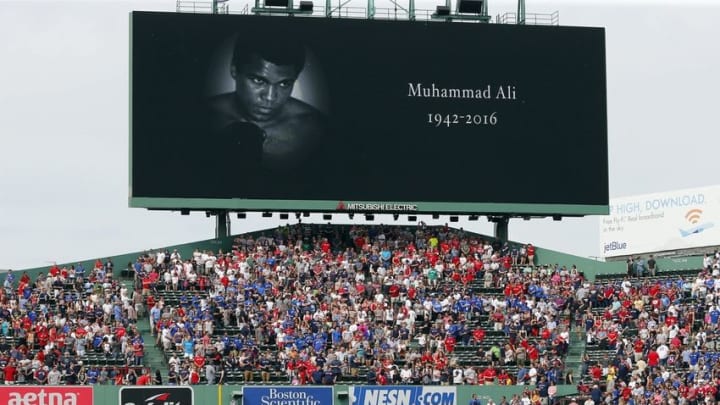 Jun 4, 2016; Boston, MA, USA; Fans and players stand for a moment of silence in honor of Muhammad Ali before the game between the Boston Red Sox and the Toronto Blue Jays at Fenway Park. Mandatory Credit: Winslow Townson-USA TODAY Sports