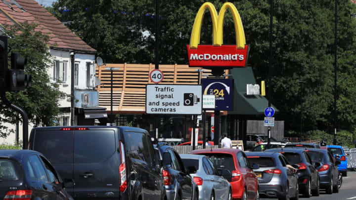 SUTTON, ENGLAND - MAY 21: Cars queue at a Drive Thru McDonald's on May 21, 2020 in Sutton, England. The British government has started easing the lockdown it imposed two months ago to curb the spread of Covid-19, abandoning its 'stay at home' slogan in favour of a message to 'be alert', but UK countries have varied in their approaches to relaxing quarantine measures. (Photo by Andrew Redington/Getty Images)