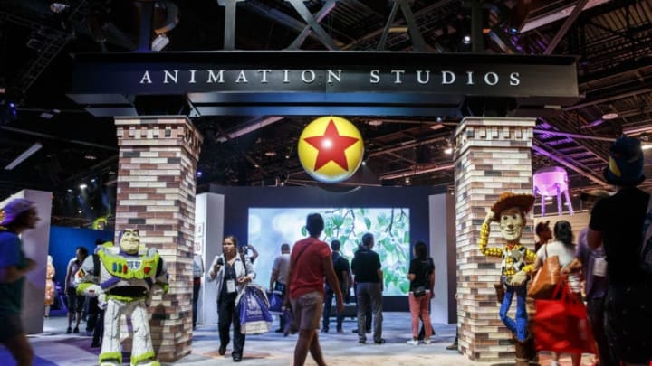 The signage for Pixar Animation Studios is displayed with characters from the Toy Story movies during the D23 Expo 2015 in Anaheim, California, U.S., on Friday, Aug. 14, 2015. The D23 Expo 2015, presented by the Official Disney Fan Club, includes sneak peeks of upcoming films from The Walt Disney Studios, celebrity appearances, as well as a look at what's coming from Disney Parks and Resort. Photographer: Patrick T. Fallon/Bloomberg via Getty Images