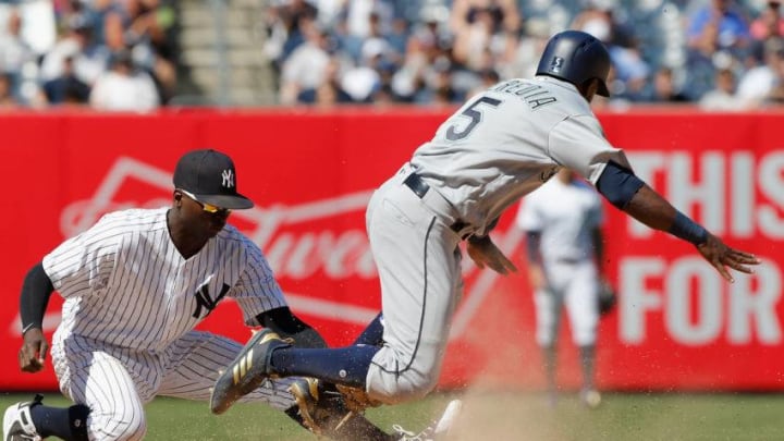 NEW YORK, NY - JUNE 21: Pinch runner Guillermo Heredia #5 of the Seattle Mariners is caught stealing second base by Didi Gregorius #18 of the New York Yankees at Yankee Stadium on June 21, 2018 in the Bronx borough of New York City. (Photo by Jim McIsaac/Getty Images)