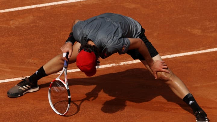 ROME, ITALY - MAY 12: Dominic Thiem of Austria reacts to a missed chance on day 5 of the the Internazionali BNL d’Italia match between Dominic Thiem of Austria and Marton Fucsovics of Hungary at Foro Italico on May 12, 2021 in Rome, Italy. Sporting stadiums around Italy remain under strict restrictions due to the Coronavirus Pandemic as Government social distancing laws prohibit fans inside venues resulting in games being played behind closed doors. (Photo by Clive Brunskill/Getty Images)