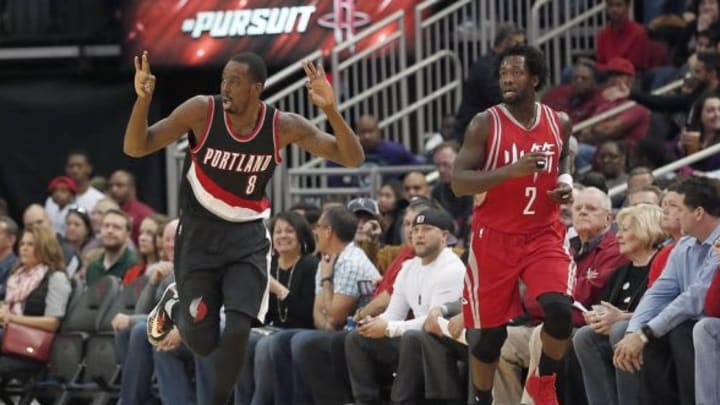 Feb 6, 2016; Houston, TX, USA; Portland Trail Blazers forward Al-Farouq Aminu (8) reacts after making a three-point basket against the Houston Rockets guard Patrick Beverley (2) in the first quarter at Toyota Center. Mandatory Credit: Thomas B. Shea-USA TODAY Sports