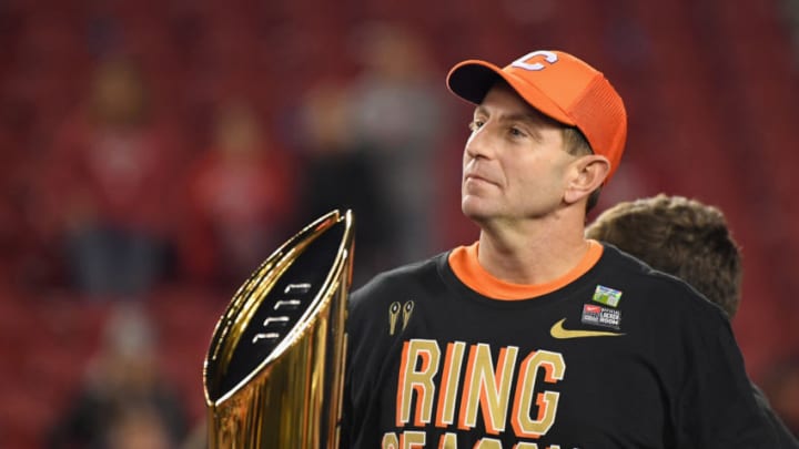 SANTA CLARA, CA - JANUARY 07: Head coach Dabo Swinney of the Clemson Tigers celebrates his teams 44-16 win over the Alabama Crimson Tide with the trophy in the CFP National Championship presented by AT&T at Levi's Stadium on January 7, 2019 in Santa Clara, California. (Photo by Harry How/Getty Images)