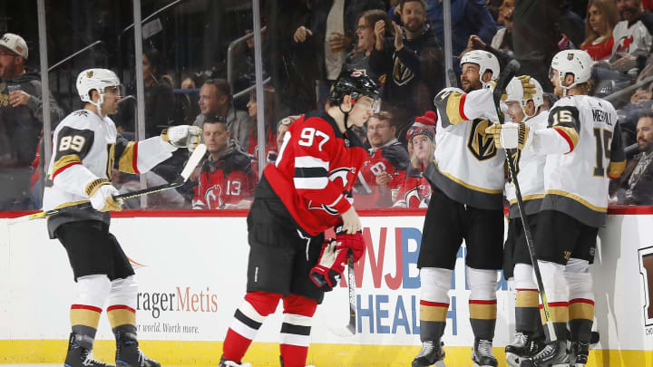 NEWARK, NJ – DECEMBER 3: Jonathan Marchessault #81 of the Vegas Golden Knights celebrates scoring his second goal of the third period as Nikita Gusev #97 of the New Jersey Devils skates away during the game at the Prudential Center on December 3, 2019 in Newark, New Jersey.The Knights defeated the Devils 4-3. (Photo by Andy Marlin/NHLI via Getty Images)