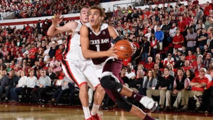 Jan 16, 2016; Athens, GA, USA; Texas A&M Aggies forward DJ Hogg (1) drives past Georgia Bulldogs forward Kenny Paul Geno (25) during the first half at Stegeman Coliseum. Mandatory Credit: Dale Zanine-USA TODAY Sports