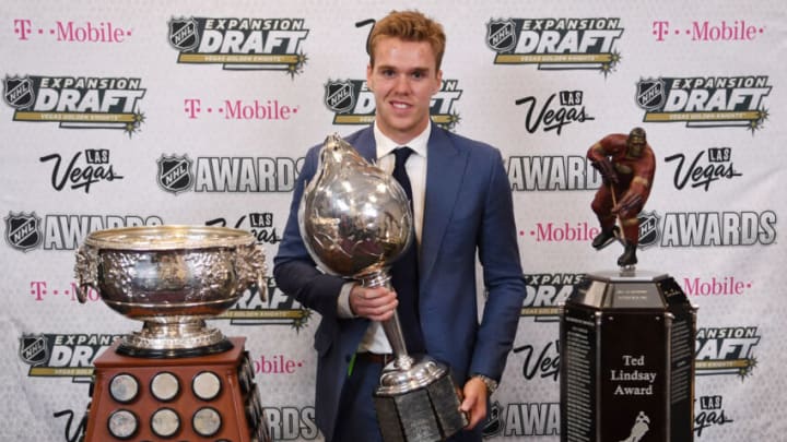 Jun 21, 2017; Las Vegas, NV, USA; Edmonton Oilers forward Connor McDavid poses for a photo with the Art Ross Trophy, Hart Trophy and Ted Lindsay Award in the interview room during the 2017 NHL Awards and Expansion Draft at T-Mobile Arena. Mandatory Credit: Stephen R. Sylvanie-USA TODAY Sports