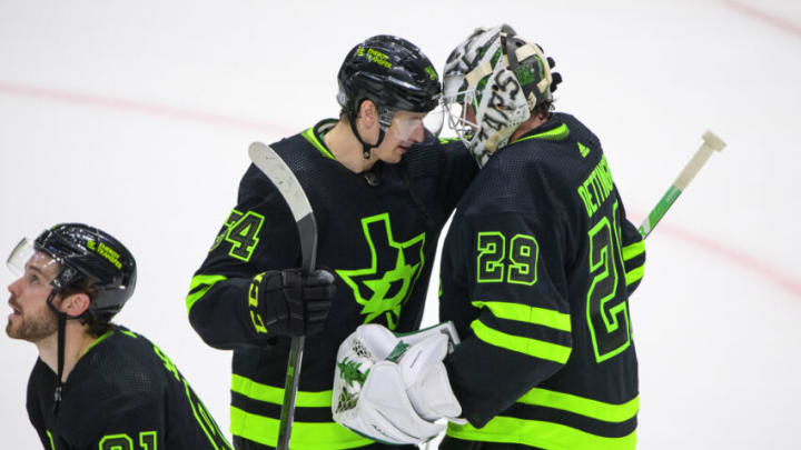 Apr 23, 2022; Dallas, Texas, USA; Dallas Stars right wing Denis Gurianov (34) and goaltender Jake Oettinger (29) celebrate the win over the Seattle Kraken at the American Airlines Center. Mandatory Credit: Jerome Miron-USA TODAY Sports