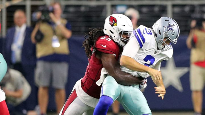 ARLINGTON, TX - AUGUST 26: Mike White #3 of the Dallas Cowboys fumbles the ball after being sacked by Vontarrius Dora #59 of the Arizona Cardinals in the fourth quarter of a preseason football game at AT&T Stadium on August 26, 2018 in Arlington, Texas. (Photo by Richard Rodriguez/Getty Images)