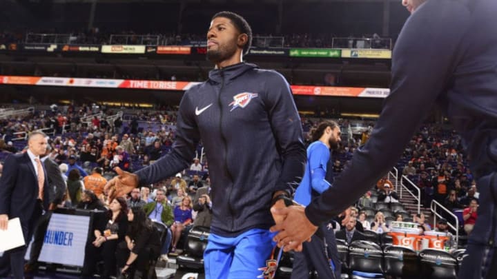 PHOENIX, AZ - NOVEMBER 17: Paul George #13 of the Oklahoma City Thunder high fives teammates as he is introduced before the game against the Phoenix Suns on November 17, 2018 at Talking Stick Resort Arena in Phoenix, Arizona. NOTE TO USER: User expressly acknowledges and agrees that, by downloading and or using this photograph, user is consenting to the terms and conditions of the Getty Images License Agreement. Mandatory Copyright Notice: Copyright 2018 NBAE (Photo by Barry Gossage/NBAE via Getty Images)