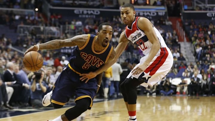 Jan 6, 2016; Washington, DC, USA; Cleveland Cavaliers guard J.R. Smith (5) dribbles the ball as Washington Wizards forward Otto Porter Jr. (22) defends in the first quarter at Verizon Center. Mandatory Credit: Geoff Burke-USA TODAY Sports
