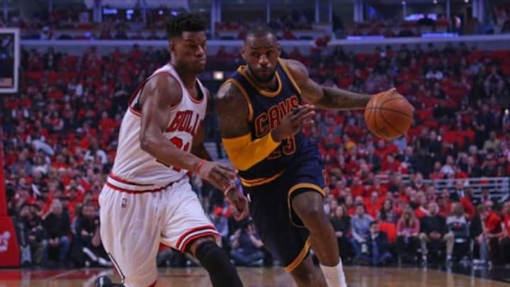 May 10, 2015; Chicago, IL, USA; Cleveland Cavaliers forward LeBron James (23) dribbles the ball as Chicago Bulls guard Jimmy Butler (21) defends in the first quarter of game four of the second round of the NBA Playoffs at the United Center. Mandatory Credit: Dennis Wierzbicki-USA TODAY Sports