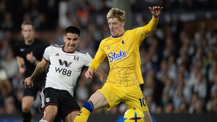 LONDON, ENGLAND - OCTOBER 29: Aleksandar Mitrovic of Fulham (L) takes a shot on goal as Anthony Gordon of Everton attempts to block during the Premier League match between Fulham FC and Everton FC at Craven Cottage on October 29, 2022 in London, England. (Photo by Visionhaus/Getty Images)