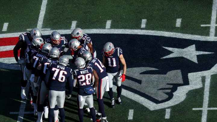 FOXBOROUGH, MASSACHUSETTS – DECEMBER 29: Tom Brady #12 of the New England Patriots talks to the offensive line in a huddle during the first quarter against the Miami Dolphins at Gillette Stadium on December 29, 2019 in Foxborough, Massachusetts. (Photo by Maddie Meyer/Getty Images)