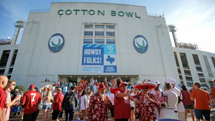 Fans take photos before the Red River Showdown college football game between the University of Oklahoma Sooners (OU) and the University of Texas (UT) Longhorns at the Cotton Bowl in Dallas, Saturday, Oct. 9, 2021.Ou Vs Texas