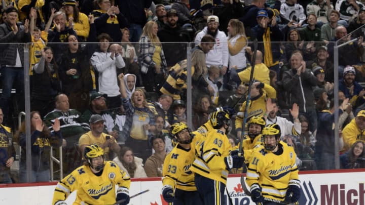 DETROIT, MI - FEBRUARY 11: T.J. Hughes #13 of the Michigan Wolverines celebrates his goal against the Michigan State Spartans with teammates during the first period of an NCAA Mens college hockey Dual in the D game at Little Caesars Arena on February 11, 2023 in Detroit, Michigan. The Wolverines defeated the Spartans 4-3 in O.T. (Photo by Dave Reginek/Getty Images)