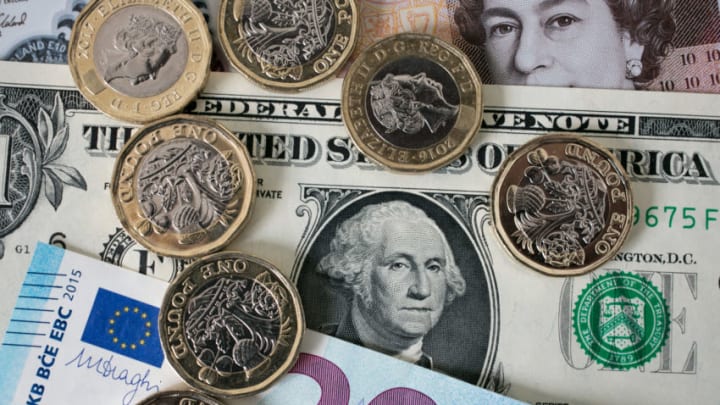 BATH, ENGLAND - OCTOBER 13: In this photo illustration, £1 coins are seen with the new £10 note alongside euro notes and US dollar bills on October 13, 2017 in Bath, England. Currency experts have warned that as the uncertainty surrounding Brexit continues, the value of the British pound, which has remained depressed against the US dollar and the euro since the UK voted to leave in the EU referendum, is likely to fluctuate. (Photo Illustration by Matt Cardy/Getty Images)