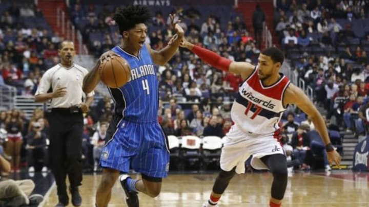 Jan 1, 2016; Washington, DC, USA; Orlando Magic guard Elfrid Payton (4) dribbles the ball as Washington Wizards guard Garrett Temple (17) defends in the first quarter at Verizon Center. Mandatory Credit: Geoff Burke-USA TODAY Sports