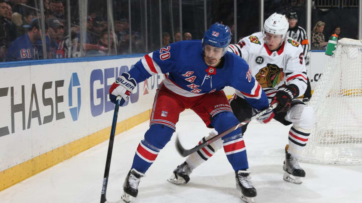 NEW YORK, NY – JANUARY 17: Chris Kreider #20 of the New York Rangers skates with the puck against Connor Murphy #5 of the Chicago Blackhawks at Madison Square Garden on January 17, 2019 in New York City. The New York Rangers won 4-3. (Photo by Jared Silber/NHLI via Getty Images)