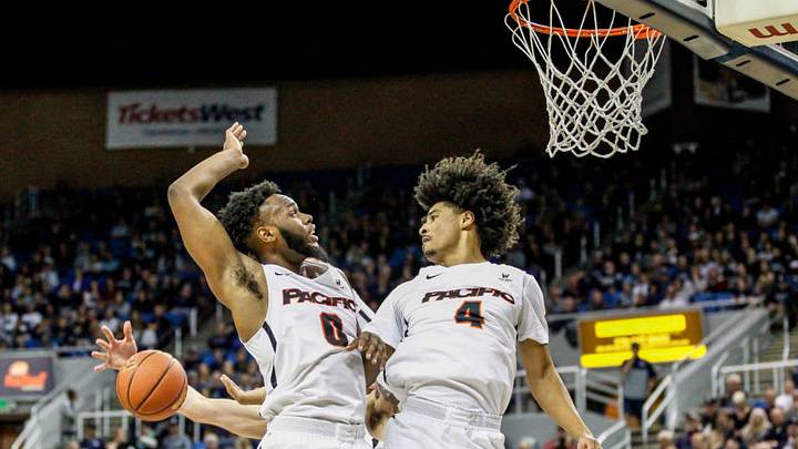 RENO, NV - NOVEMBER 09: Jahlil Tripp #0 of the Pacific Tigers and Roberto Gallinat #4 of the Pacific Tigers jump together to cover a shot by the Nevada Wolf Pack at Lawlor Events Center on November 9, 2018 in Reno, Nevada. (Photo by Jonathan Devich/Getty Images)