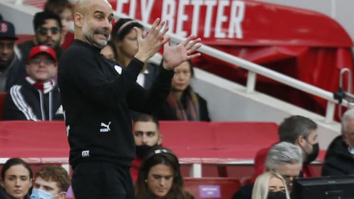 Manchester City's Spanish manager Pep Guardiola gestures during the English Premier League football match between Arsenal and Manchester City at the Emirates Stadium in London on January 1, 2022. - - RESTRICTED TO EDITORIAL USE. No use with unauthorized audio, video, data, fixture lists, club/league logos or 'live' services. Online in-match use limited to 120 images. An additional 40 images may be used in extra time. No video emulation. Social media in-match use limited to 120 images. An additional 40 images may be used in extra time. No use in betting publications, games or single club/league/player publications. (Photo by Ian KINGTON / IKIMAGES / AFP) / RESTRICTED TO EDITORIAL USE. No use with unauthorized audio, video, data, fixture lists, club/league logos or 'live' services. Online in-match use limited to 120 images. An additional 40 images may be used in extra time. No video emulation. Social media in-match use limited to 120 images. An additional 40 images may be used in extra time. No use in betting publications, games or single club/league/player publications. / RESTRICTED TO EDITORIAL USE. No use with unauthorized audio, video, data, fixture lists, club/league logos or 'live' services. Online in-match use limited to 120 images. An additional 40 images may be used in extra time. No video emulation. Social media in-match use limited to 120 images. An additional 40 images may be used in extra time. No use in betting publications, games or single club/league/player publications. (Photo by IAN KINGTON/IKIMAGES/AFP via Getty Images)