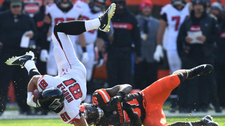 CLEVELAND, OH - NOVEMBER 11: Austin Hooper #81 of the Atlanta Falcons flies through the air after being tackled by Jamie Collins #51 of the Cleveland Browns in the first half at FirstEnergy Stadium on November 11, 2018 in Cleveland, Ohio. (Photo by Jason Miller/Getty Images)