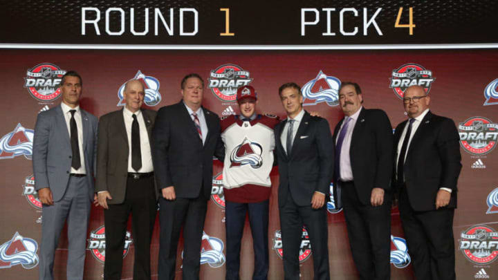 CHICAGO, IL - JUNE 23: (L-R) Head coach Jared Bednar, draft team member, draft team member, fourth overall pick Cale Makar, general manager Joe Sakic, director of reserve list scouting Brad Smith and director of amateur scouting Alan Hepple of the Colorado Avalanche pose for a photo onstage during Round One of the 2017 NHL Draft at United Center on June 23, 2017 in Chicago, Illinois. (Photo by Dave Sandford/NHLI via Getty Images)