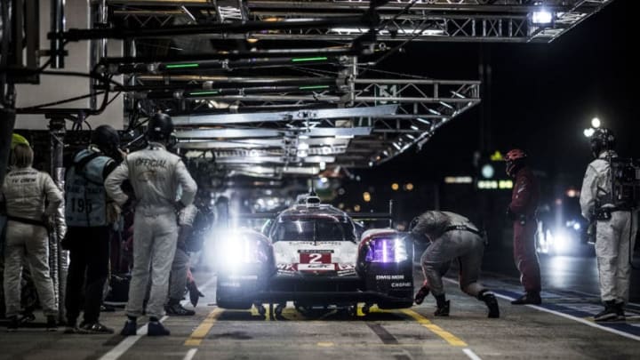 LE MANS, FRANCE - JUNE 14: (EDITORIAL USE ONLY) In this handout image provided by Red Bull, The #2 Porsche LMP1 919 Hybrid driven by Timo Bernhard of Germany, and Brendon Hartley and Earl Bamber of New Zealand in the pits during the first qualifying session for the 24 Hours of Le Mans, the third round of the 2017 FIA World Endurance Championship at Circuit de la Sarthe on June 14, 2017 in Le Mans, France. (Photo by Dean Treml/Red Bull via Getty Images)