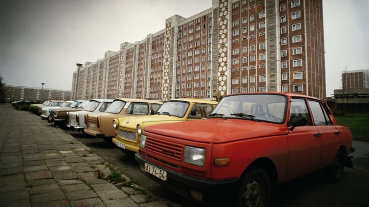 A Wartburg car next to a Trabant, possibly in East Germany, circa 1990. (Photo by Tom Stoddart/Getty Images)