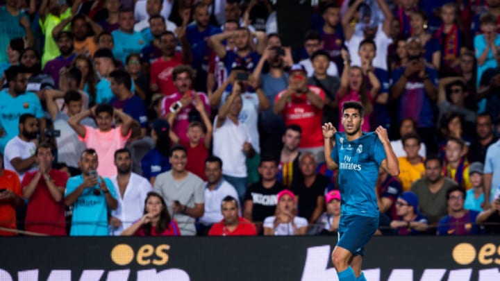 BARCELONA, SPAIN - AUGUST 13: Marco Asensio of Real Madrid CF celebrates after scoring his team's third goal during the Supercopa de Espana Supercopa Final 1st Leg match between FC Barcelona and Real Madrid at Camp Nou on August 13, 2017 in Barcelona, Spain. (Photo by Alex Caparros/Getty Images)