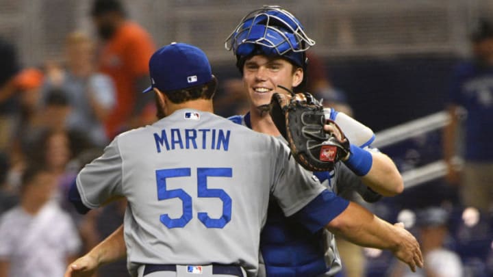 MIAMI, FL - AUGUST 13: Russell Martin #55 and Will Smith #16 of the Los Angeles Dodgers celebrate the win after the game against the Miami Marlins at Marlins Park on August 13, 2019 in Miami, Florida. (Photo by Mark Brown/Getty Images)