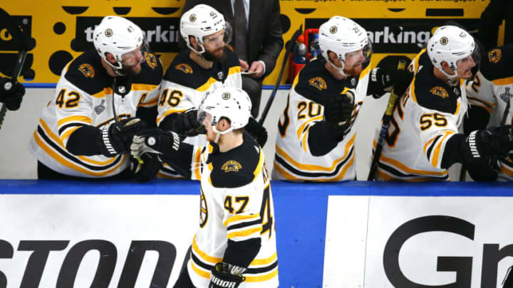 ST LOUIS, MISSOURI - JUNE 01: Torey Krug #47 of the Boston Bruins is congratulated by his teammates after scoring a second period goal against the St. Louis Blues in Game Three of the 2019 NHL Stanley Cup Final at Enterprise Center on June 01, 2019 in St Louis, Missouri. (Photo by Dilip Vishwanat/Getty Images)