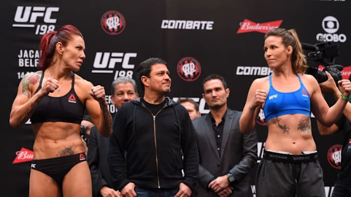 CURITIBA, BRAZIL - MAY 13: (L-R) Opponents Cristiane 'Cyborg' Justino of Brazil and Leslie Smith face off during the UFC 198 weigh-in at Arena da Baixada stadium on May 13, 2016 in Curitiba, Parana, Brazil. (Photo by Josh Hedges/Zuffa LLC/Zuffa LLC via Getty Images)